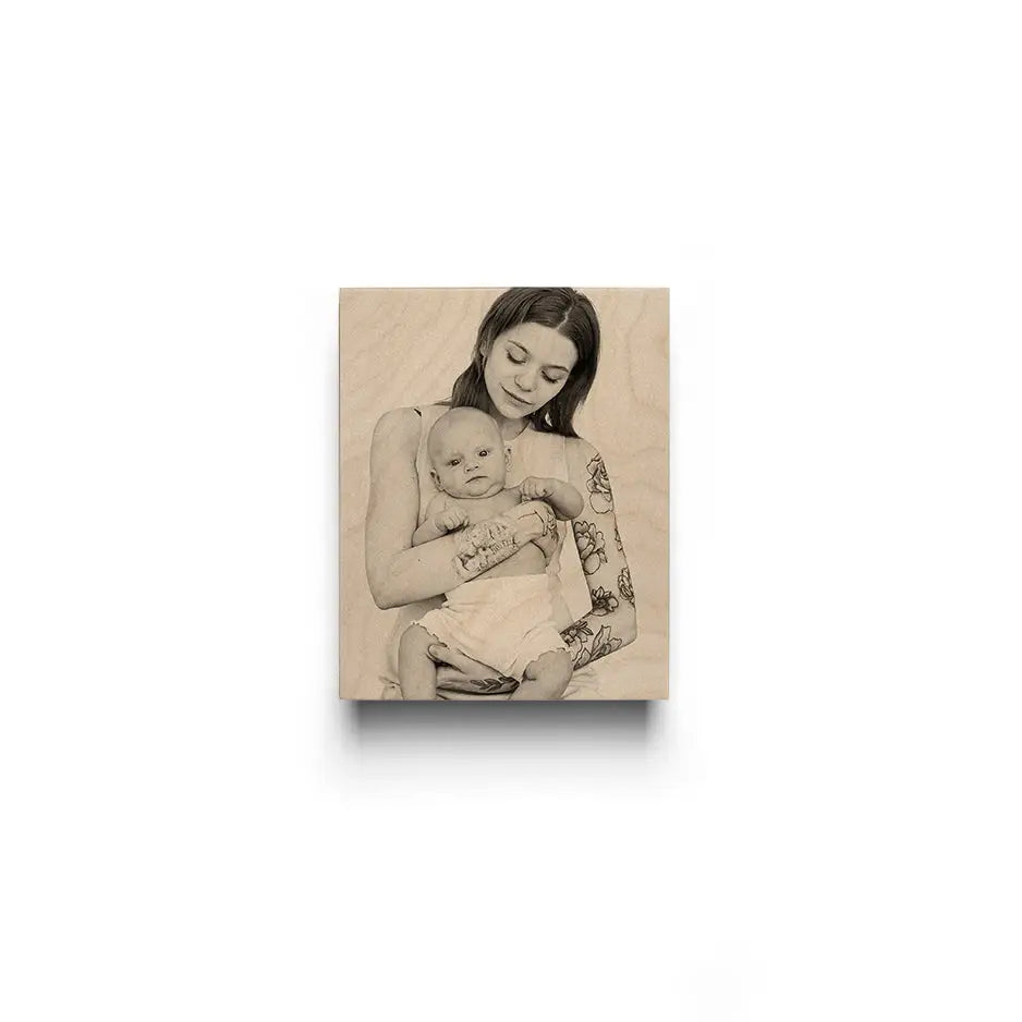 A woman holding a baby, featured in an 8x10 Original Cove Print for home decor