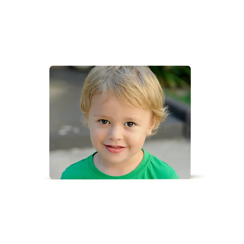 Young boy with blonde hair in green shirt on 8x10 photo tile display