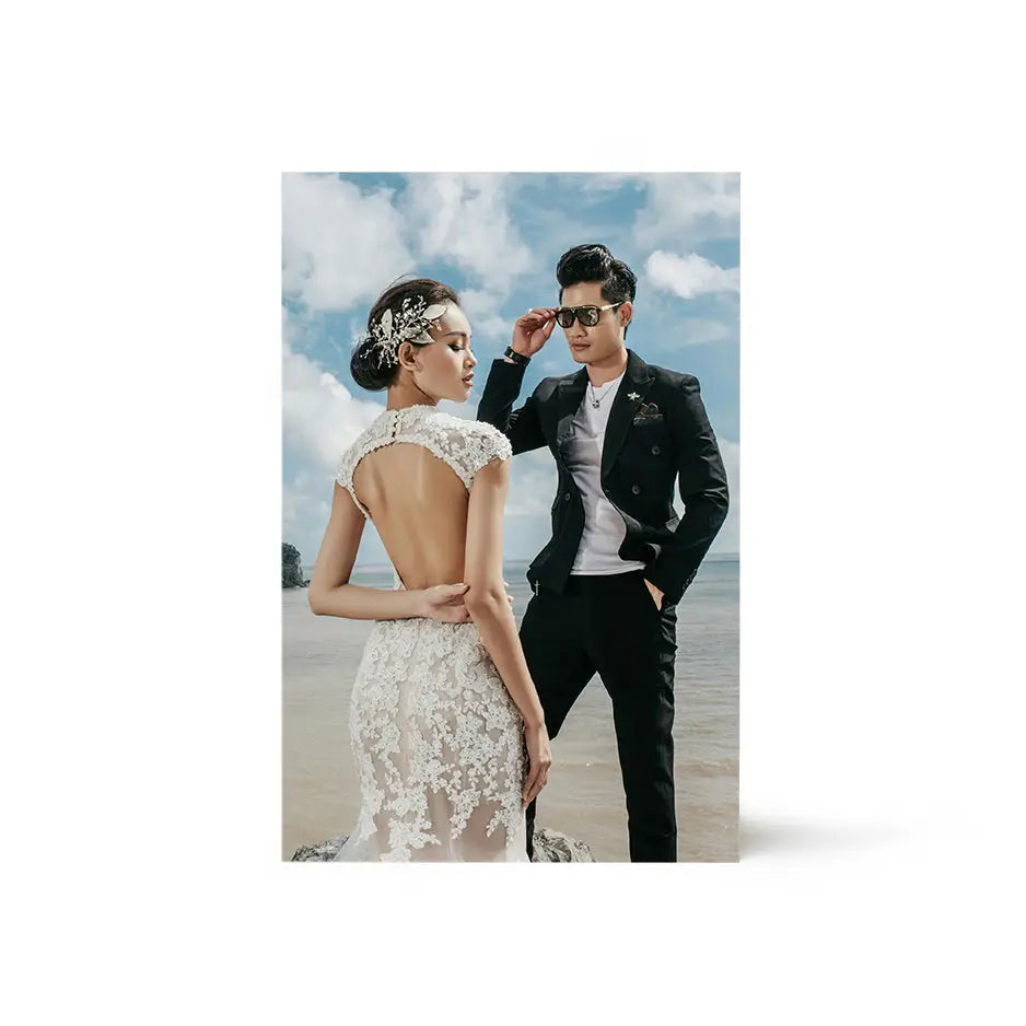 A man and woman in formal attire on the beach with an 8x12 Birch Photo Mount Print