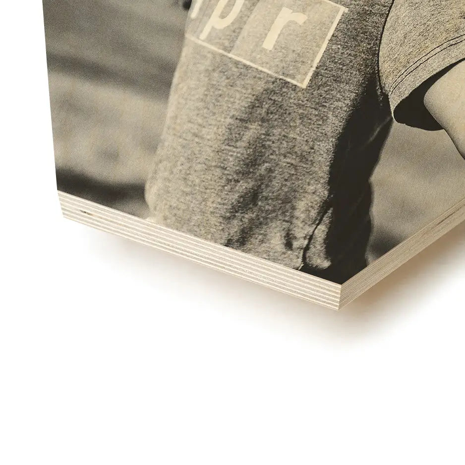 Black and white photo of a person holding a book on 8x8 hexagon wood print vintage