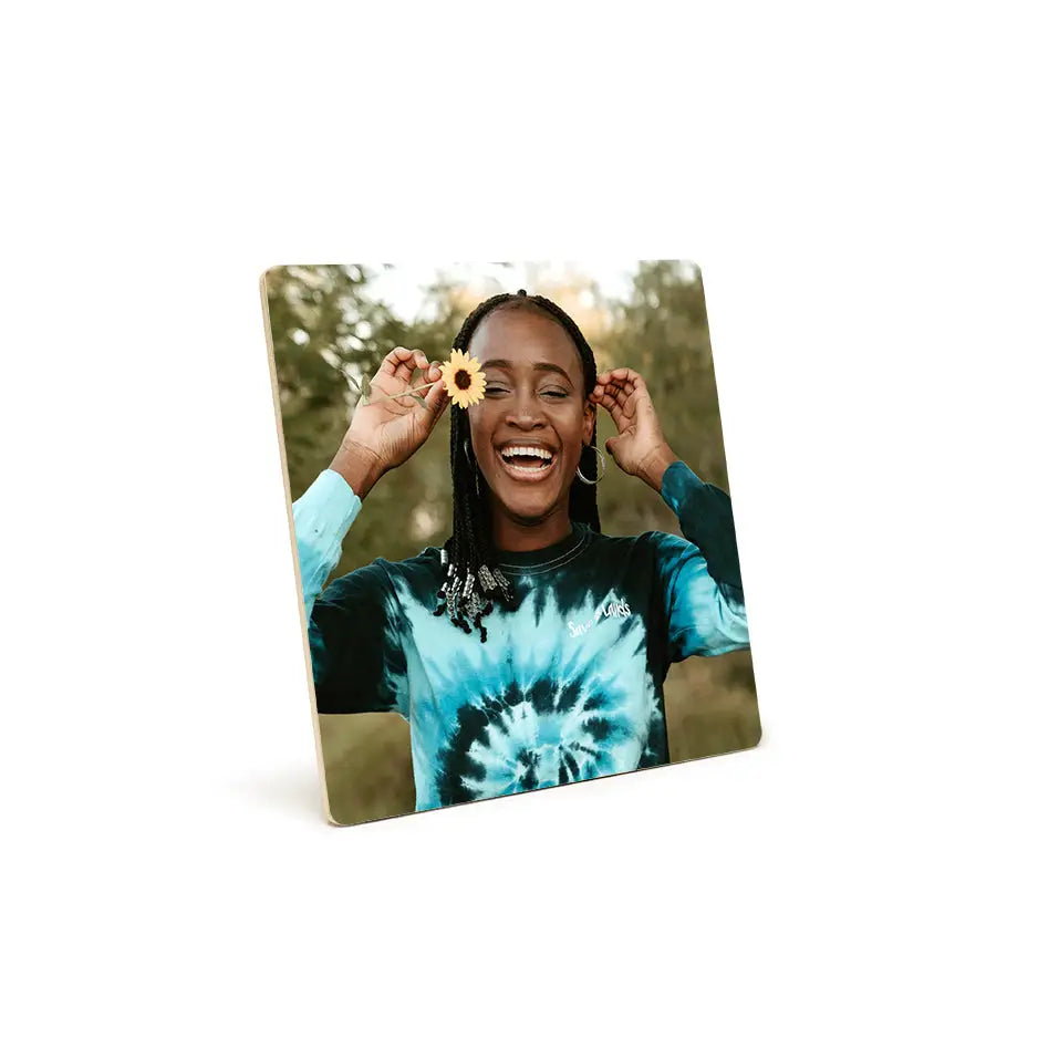 Woman smiling with a flower, featured on an 8x8 Photo Tile