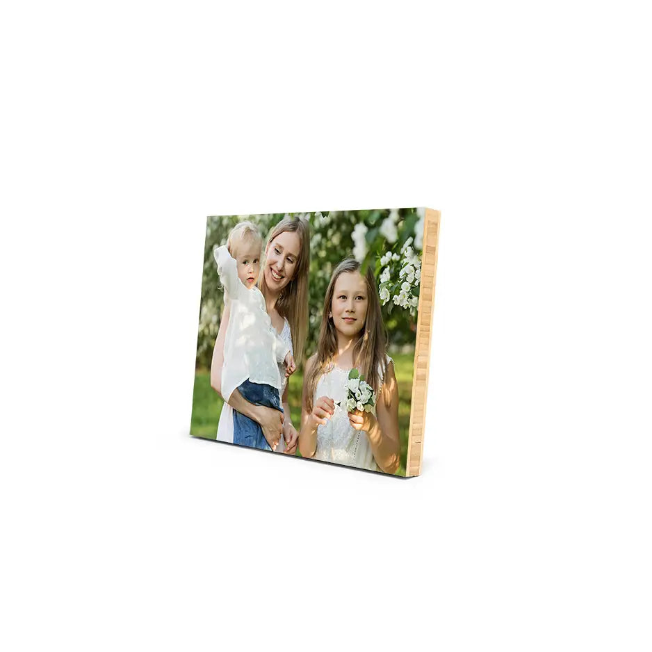 Wooden photo frame featuring two girls in a Bamboo Photo Mount Print display