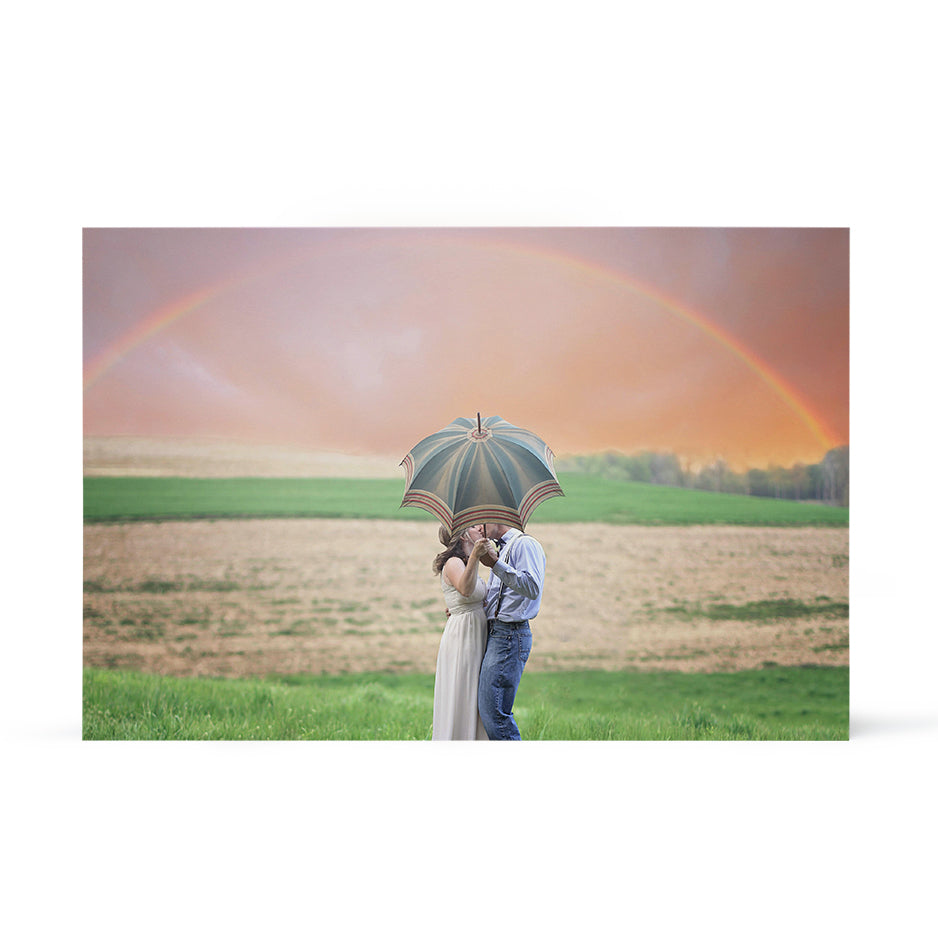 Couple under a rainbow sharing an umbrella in Birch Bright White Prints