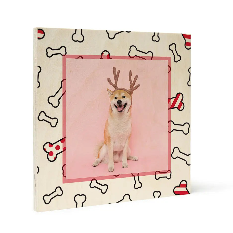 Smiling dog in reindeer antlers on Birch Pattern Wood Print with Christmas dog bones