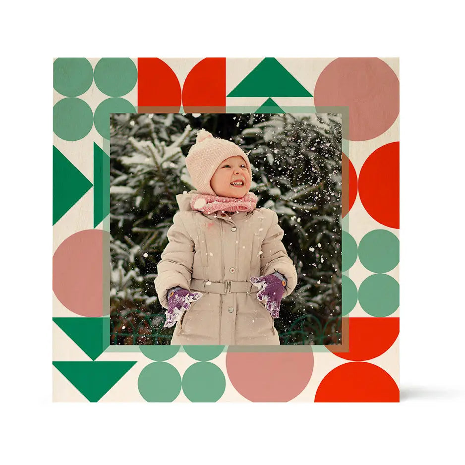 Framed photo of a child in winter clothing with Birch Pattern Wood Print background