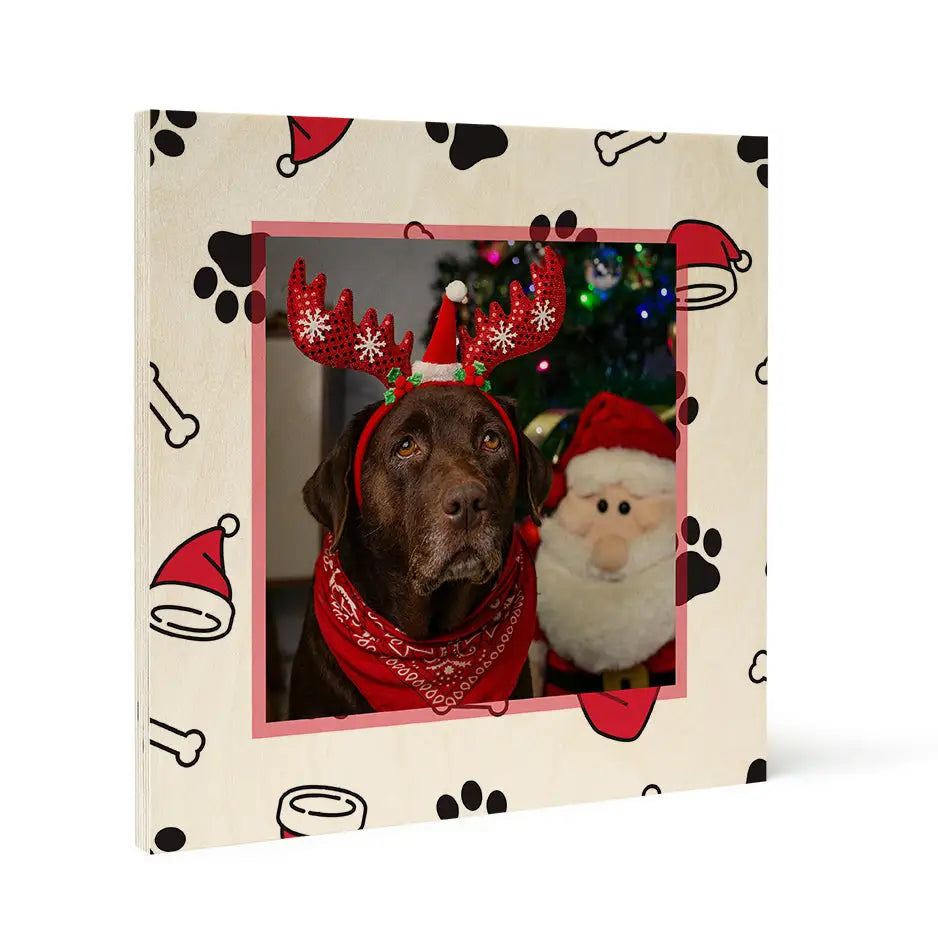 Chocolate Labrador in reindeer antlers next to Santa Claus on Birch Pattern Wood Print