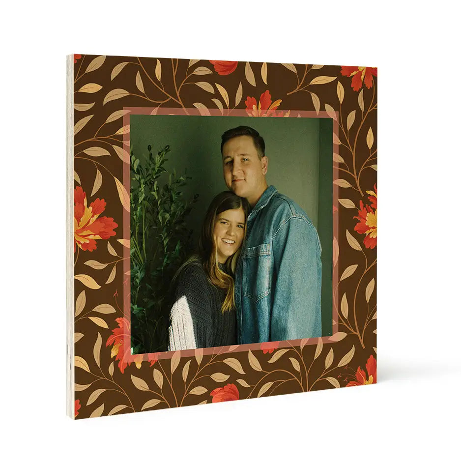 Couple posing in framed photograph on Birch Pattern Wood Print with Fall Red Floral design