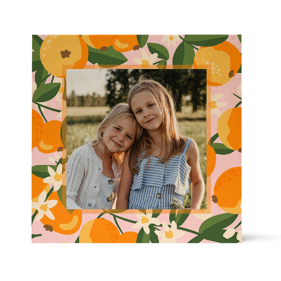 Square photo frame featuring vibrant orange fruit pattern in Birch Pattern Wood Print