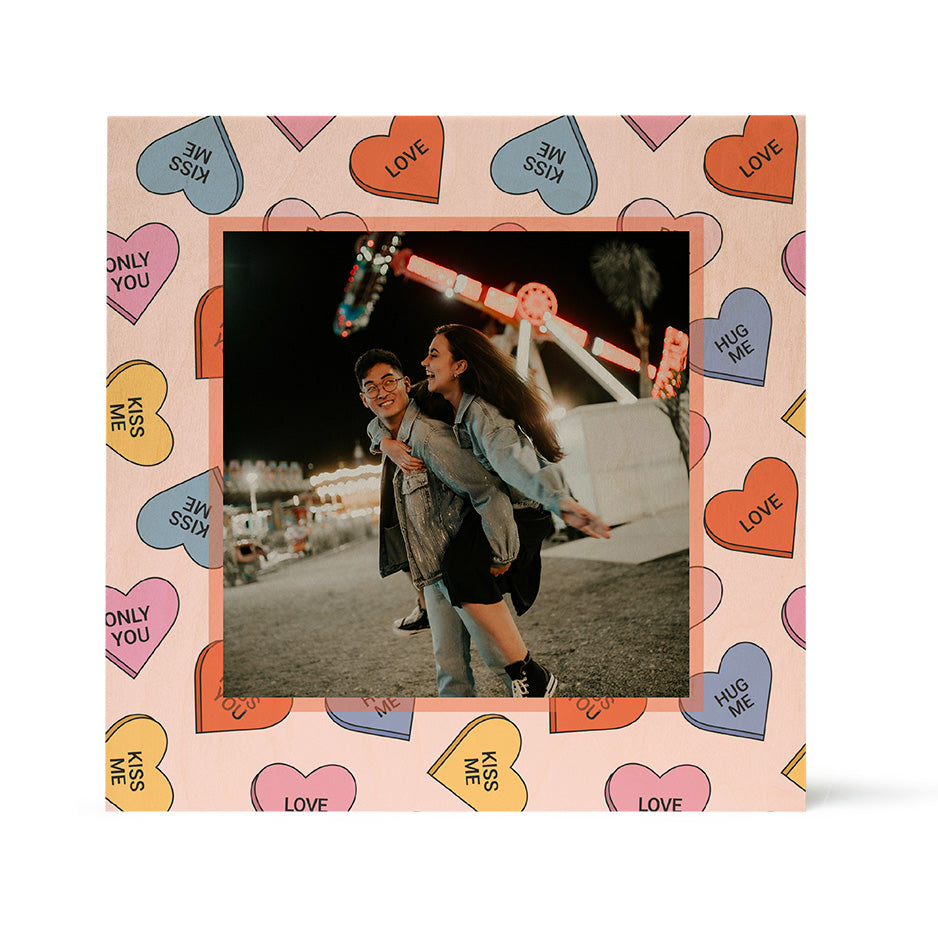 Playful piggyback moment in a Birch Pattern Wood Print with Valentine Heart Candy frame