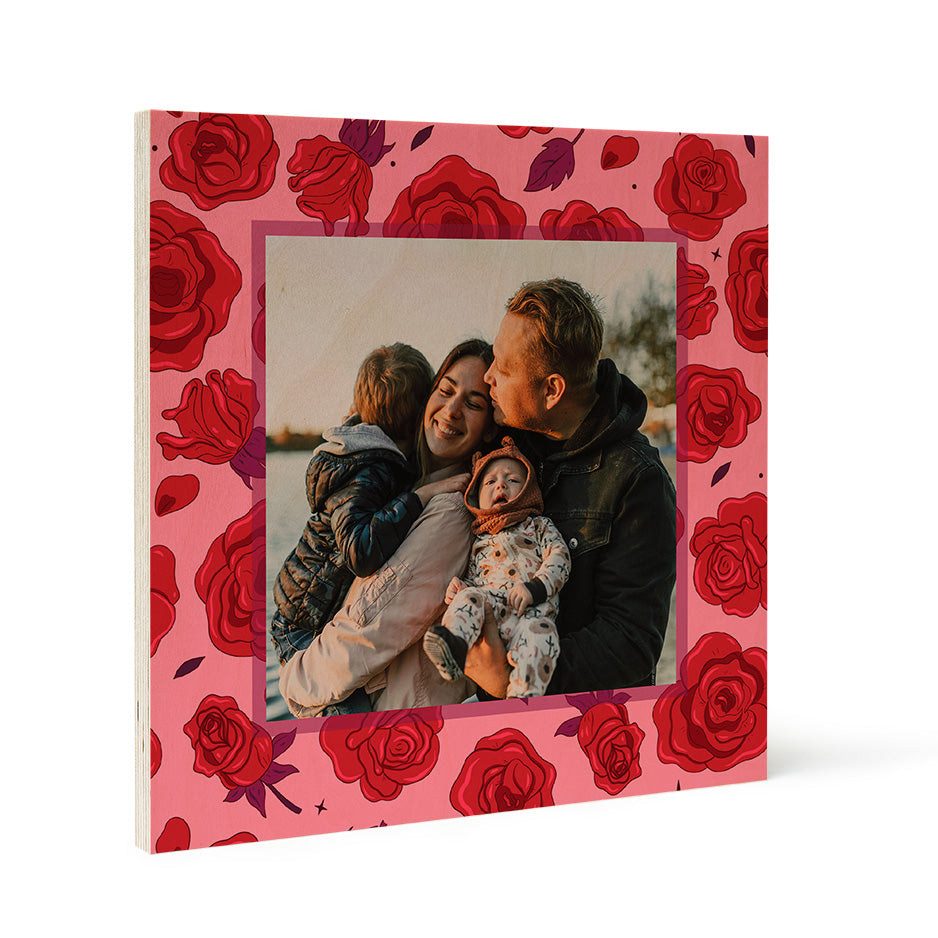 Family photograph in a pink frame with red rose design on Birch Pattern Wood Print