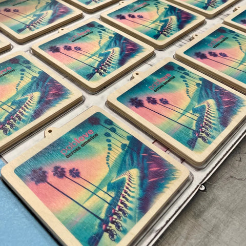 Wooden coasters with tropical beach scenes supporting Pablove Foundation and Crafting Kindness.