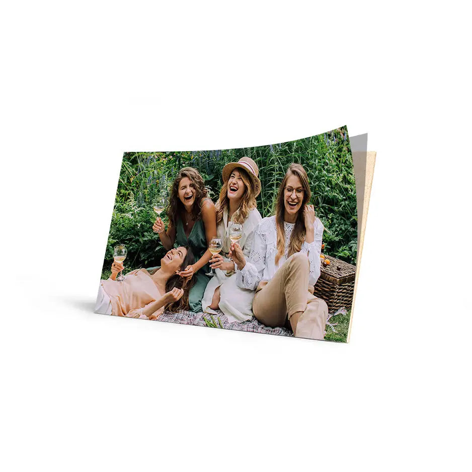 Three women enjoying a sunny day on a bench in grass with Cove Edge Photo mount