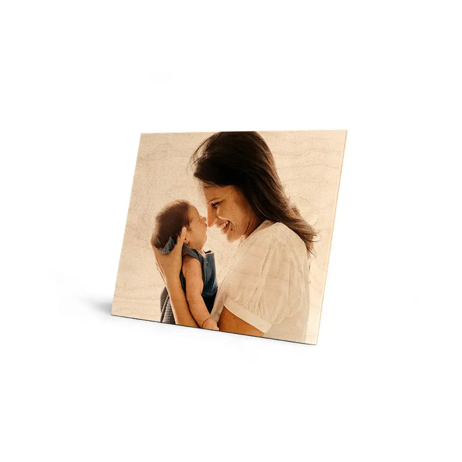 Tender parent-child moment in sepia on Cove Edge Wood Print. Perfect for home decor