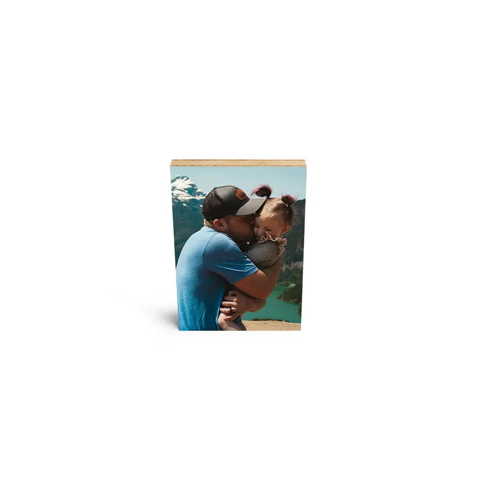 Couple kissing by a lake on a 5x7 bamboo wood print for lasting memories