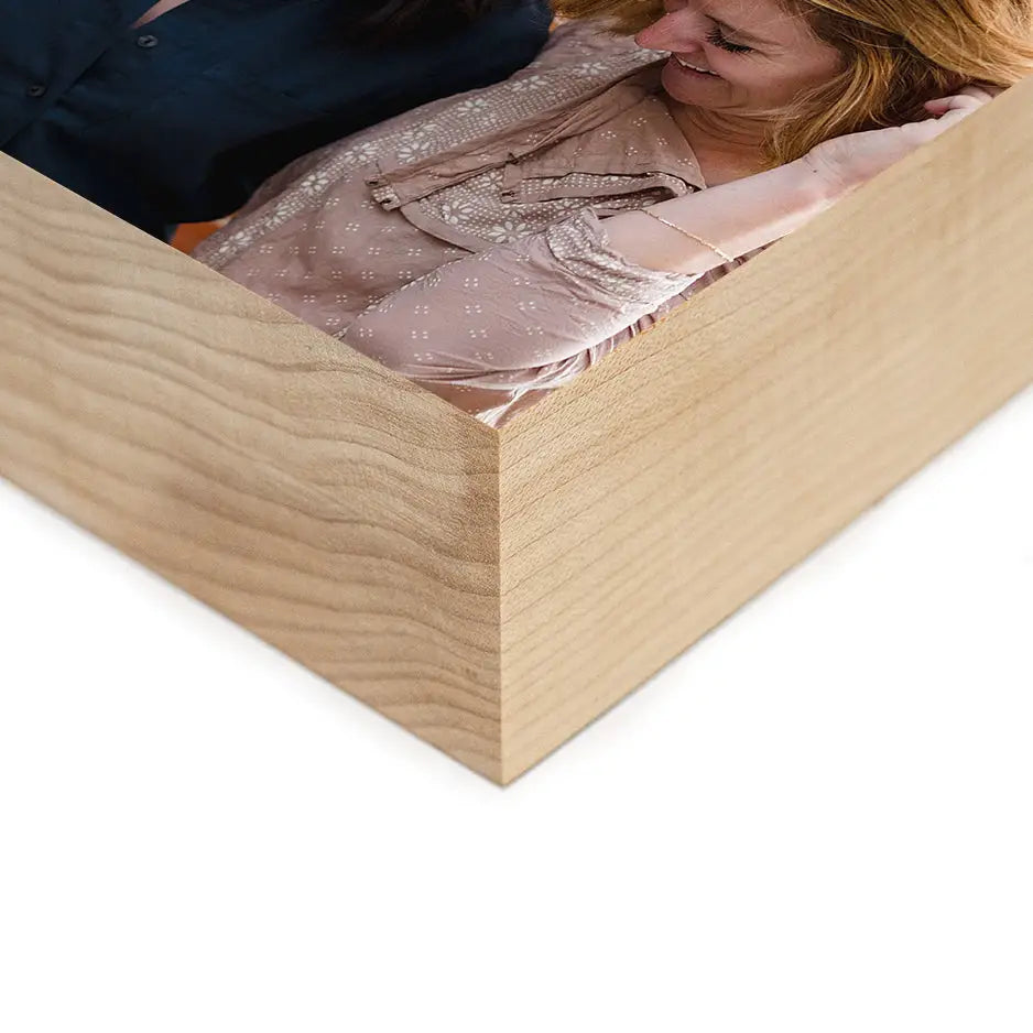 Woman holding a 5x7 Maple Photo Block with a cherished photo inside