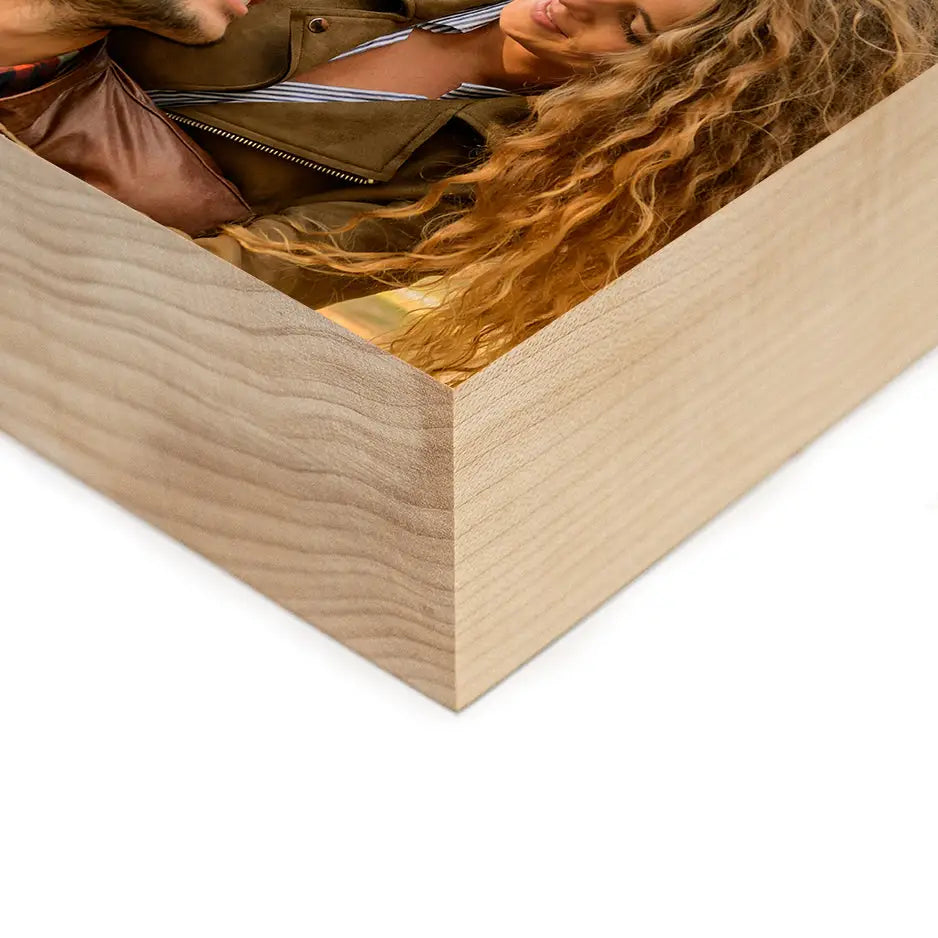 Woman relaxing on a wooden box with a 6x6 Maple Photo Block decor