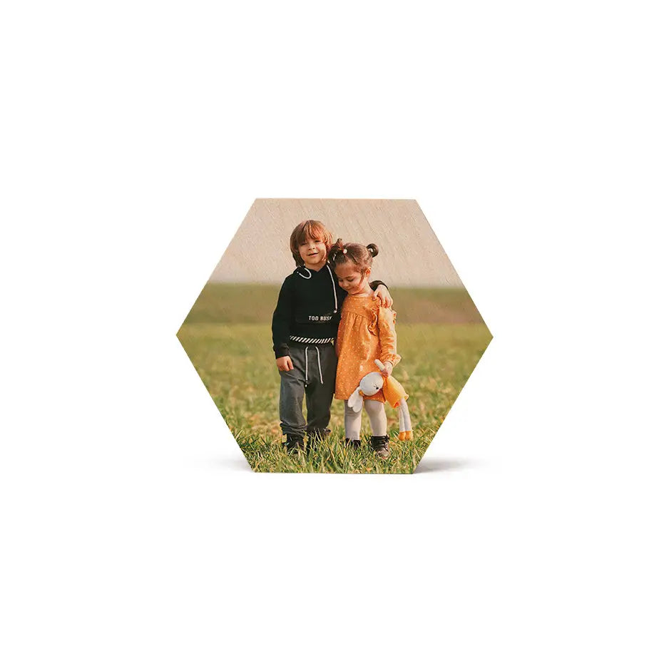 Two children playing in a field featured on a Hexagon Stash Box Print