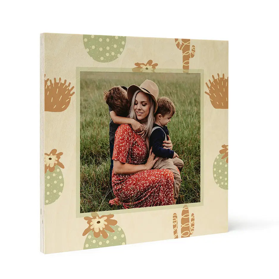 Framed photograph of a woman with children in grassy field on Pattern Wood Print