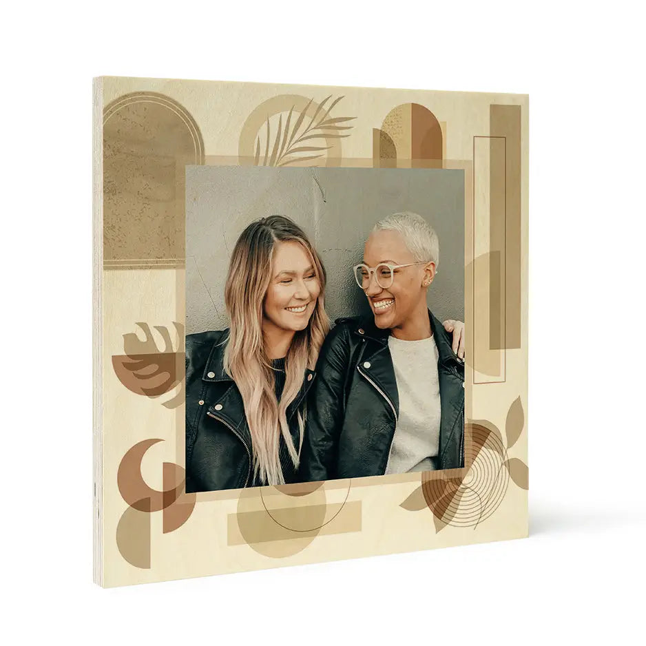 Framed photograph of a smiling couple in leather jackets on Pattern Wood Print Earth & Moon