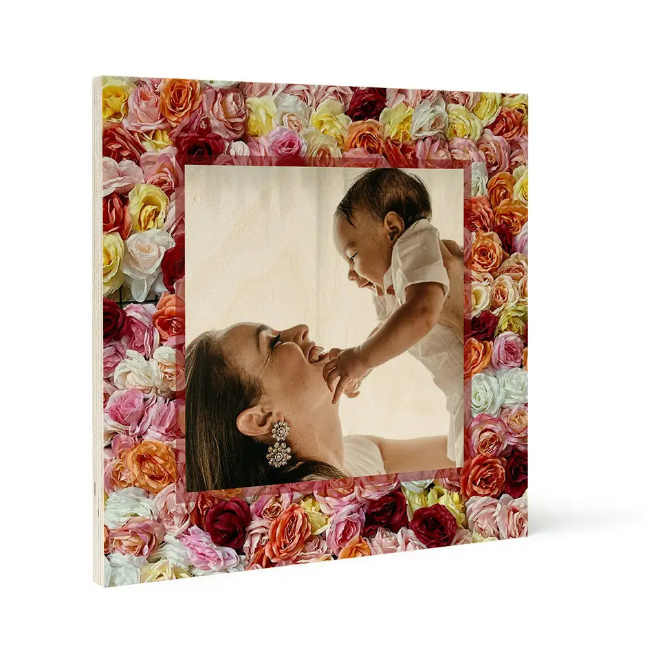 Colorful roses frame a photo locket wood print of a woman and baby, perfect for decor