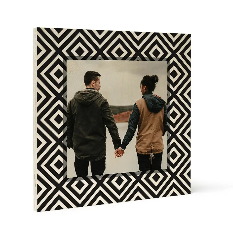 Couple holding hands from behind in a seamless geometric pattern wood print frame