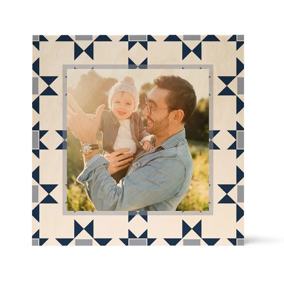 Framed photo of a man and child outdoors on a Triangle Star pattern wood print