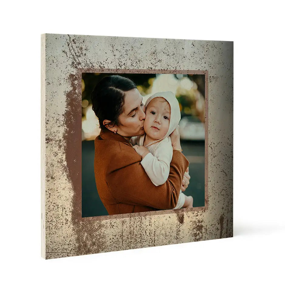 Framed photo locket of a woman kissing a baby on Pattern Wood Print with metal texture