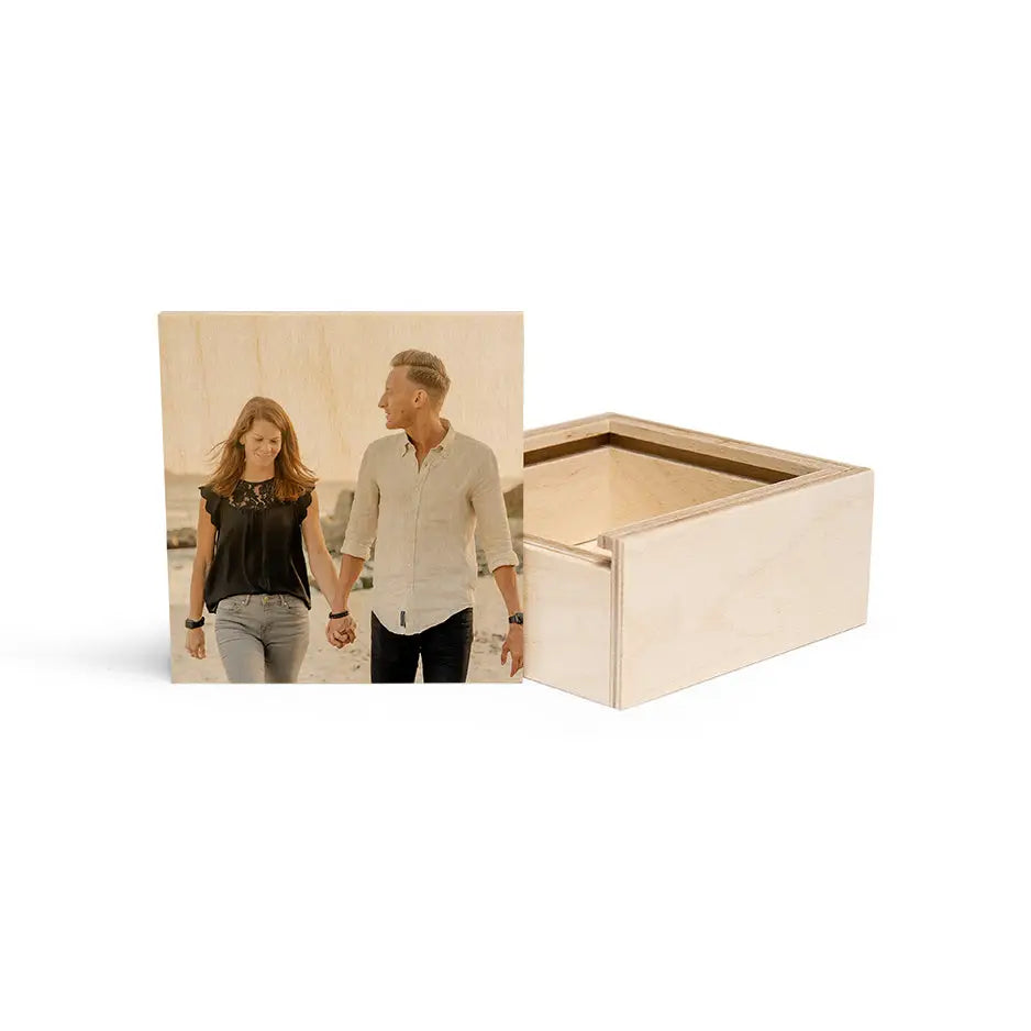 Couple holding hands atop a Personalized Mini Keepsake Wood Box for treasured memories