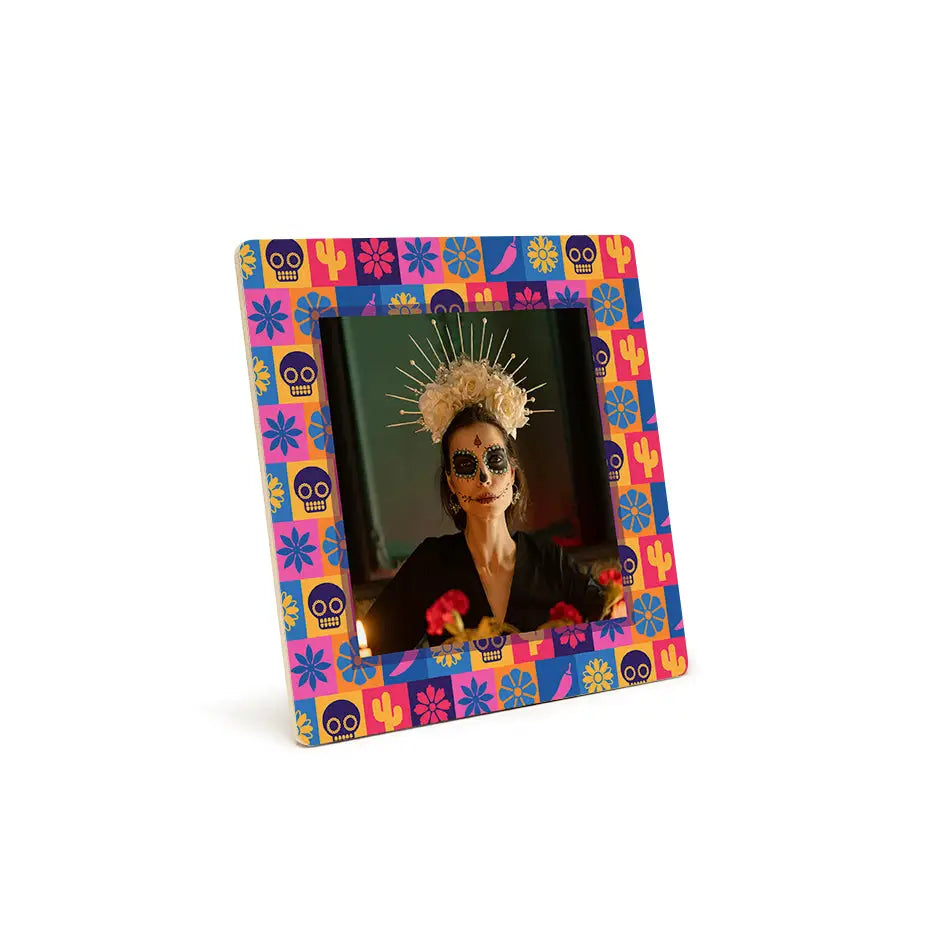 Colorful Day of the Dead photo frame with traditional makeup and headdress design
