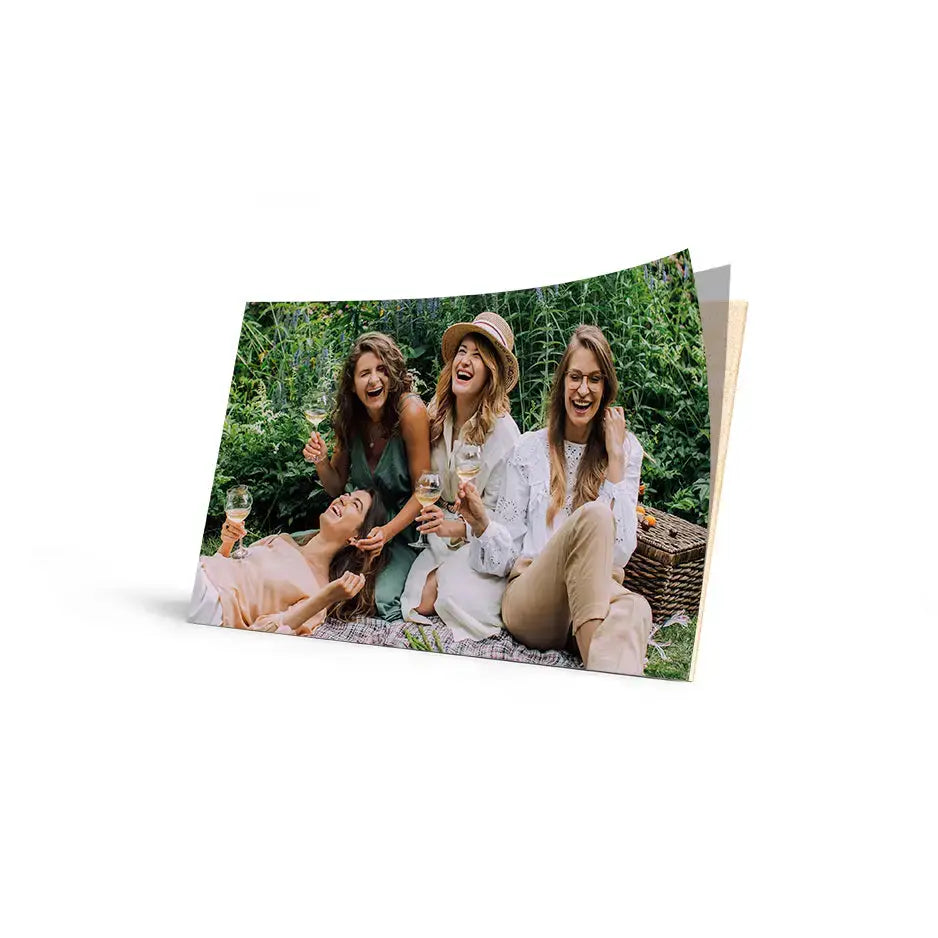 Photo prints of four women enjoying a picnic, showcasing warm wood photo prints