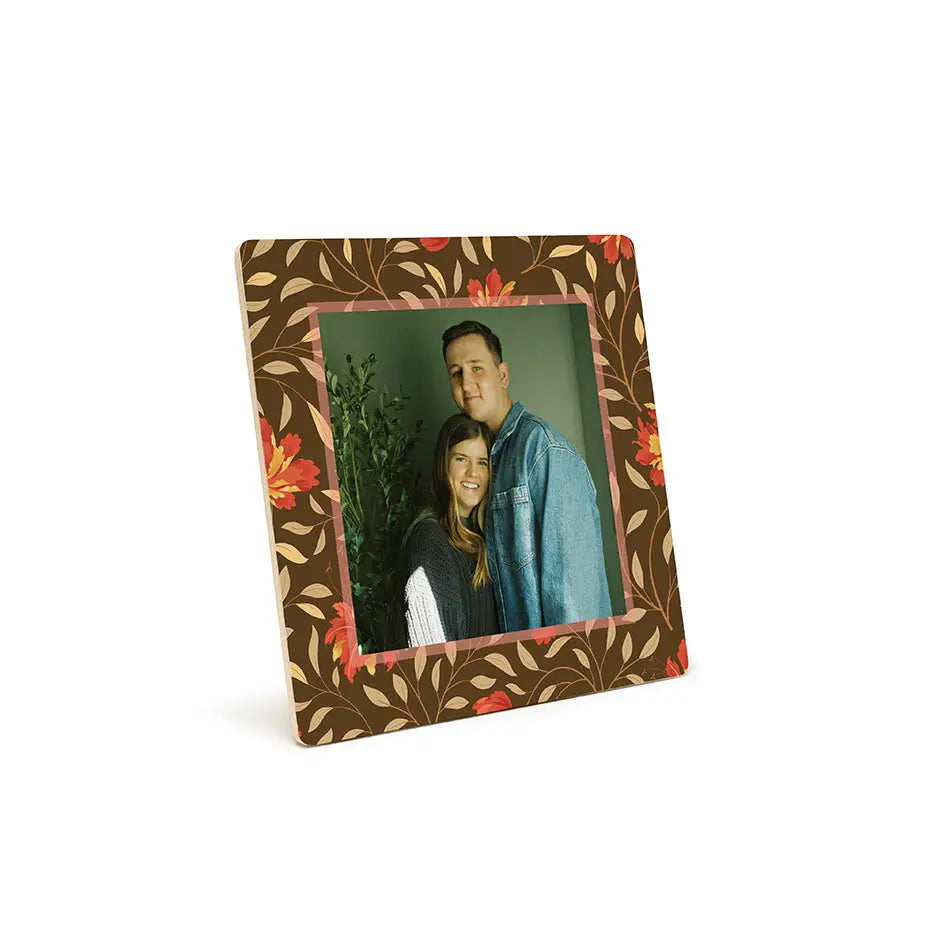 Framed photograph of two people in a Fall Red Floral photo tile pattern frame