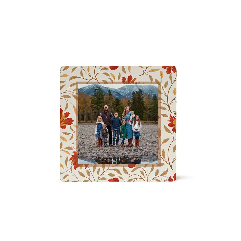 Framed family photograph with a fall tan floral border on wood print photo tile pattern