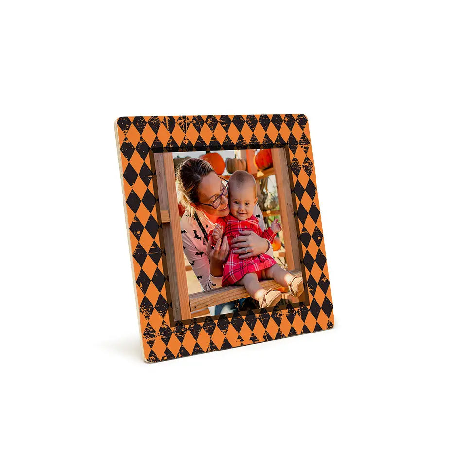 Halloween-themed photo tile pattern print with orange checkered design in a frame