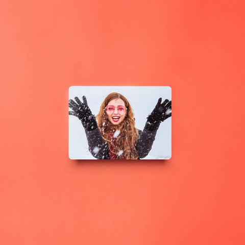 Smiling woman in pink sunglasses poses with raised arms for stunning photo tile prints.