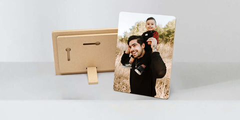 Photograph of two people on a wooden stand, showcasing stunning photo tile prints.