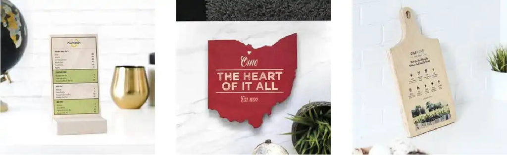 Red wooden cutout of Ohio state with text ’The Heart of it All’