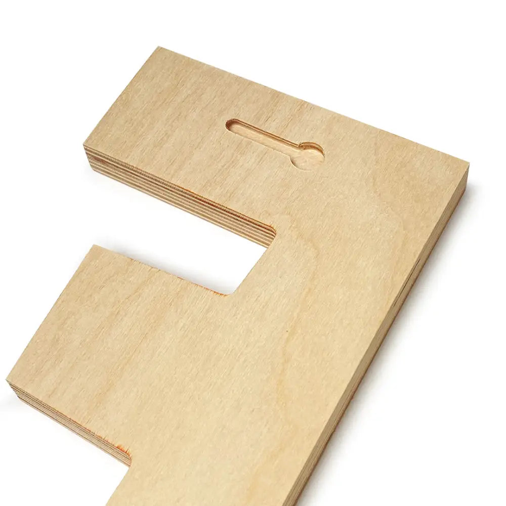 Wooden letter ’F’ with a curved cutout in the top section.