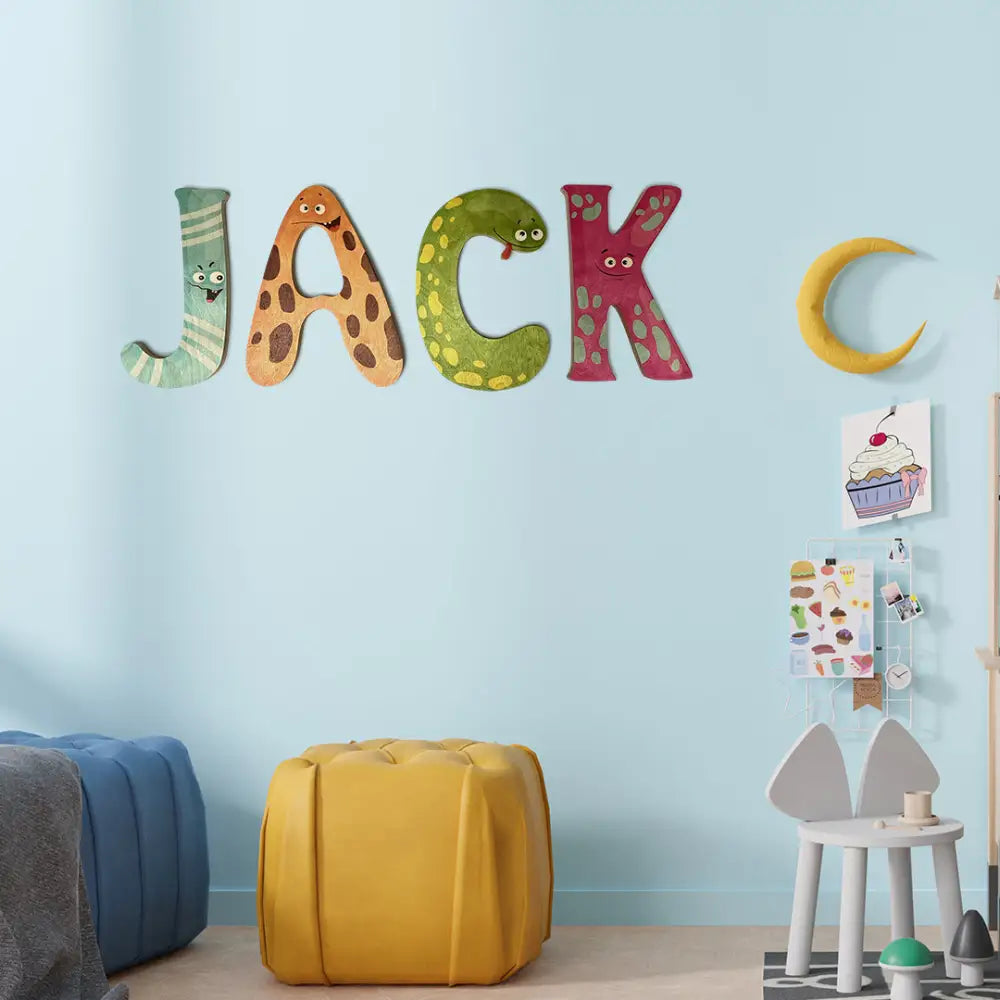 Colorful letters spelling out ’JACK’ on a wall, with each letter designed as a different character or object.