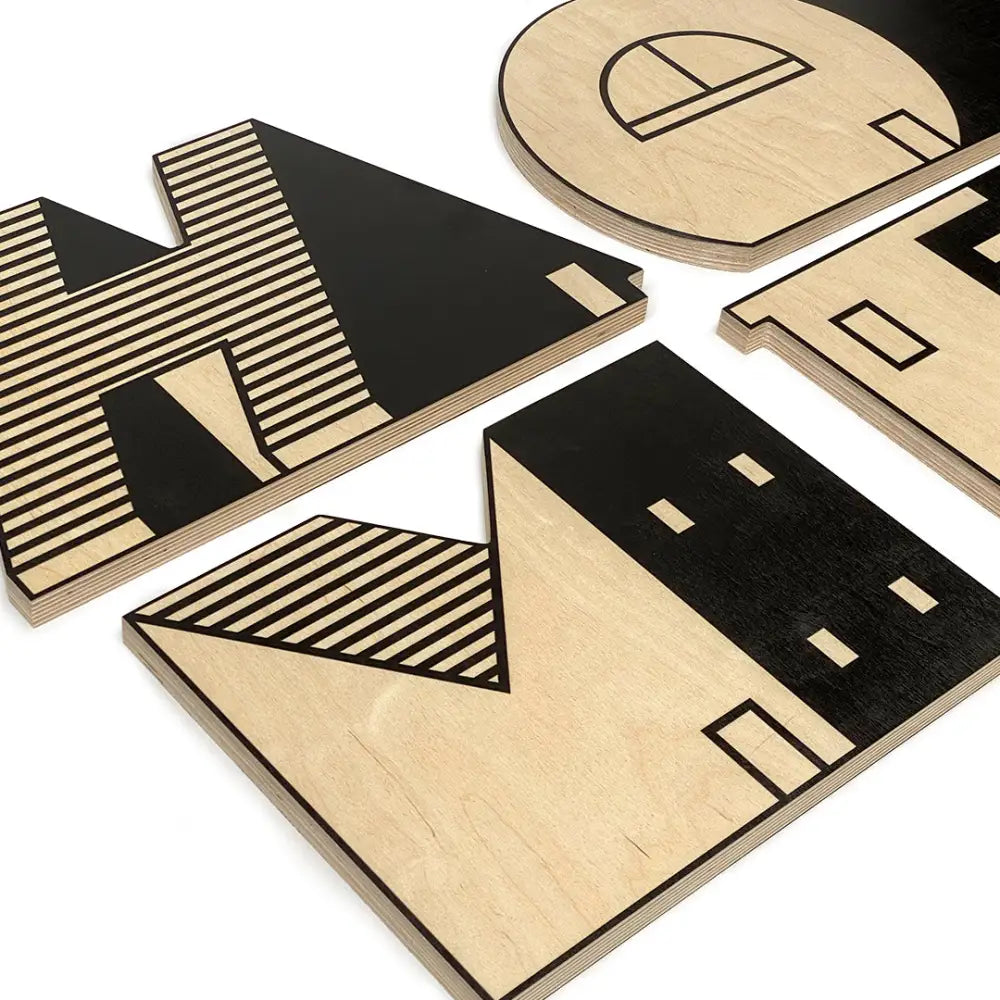 Set of geometric wooden coasters with abstract architectural designs.