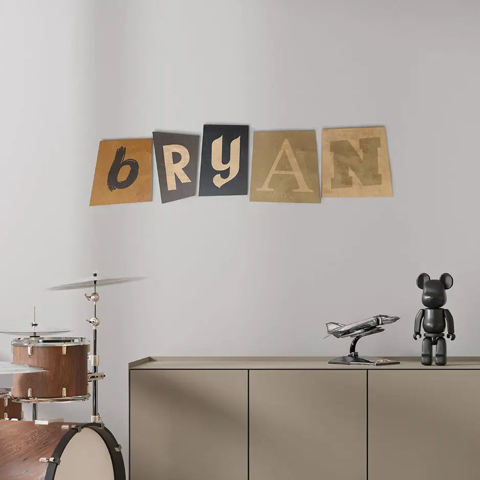 Colorful textured letters spelling Bryan on a wall, perfect for vintage wood print decor