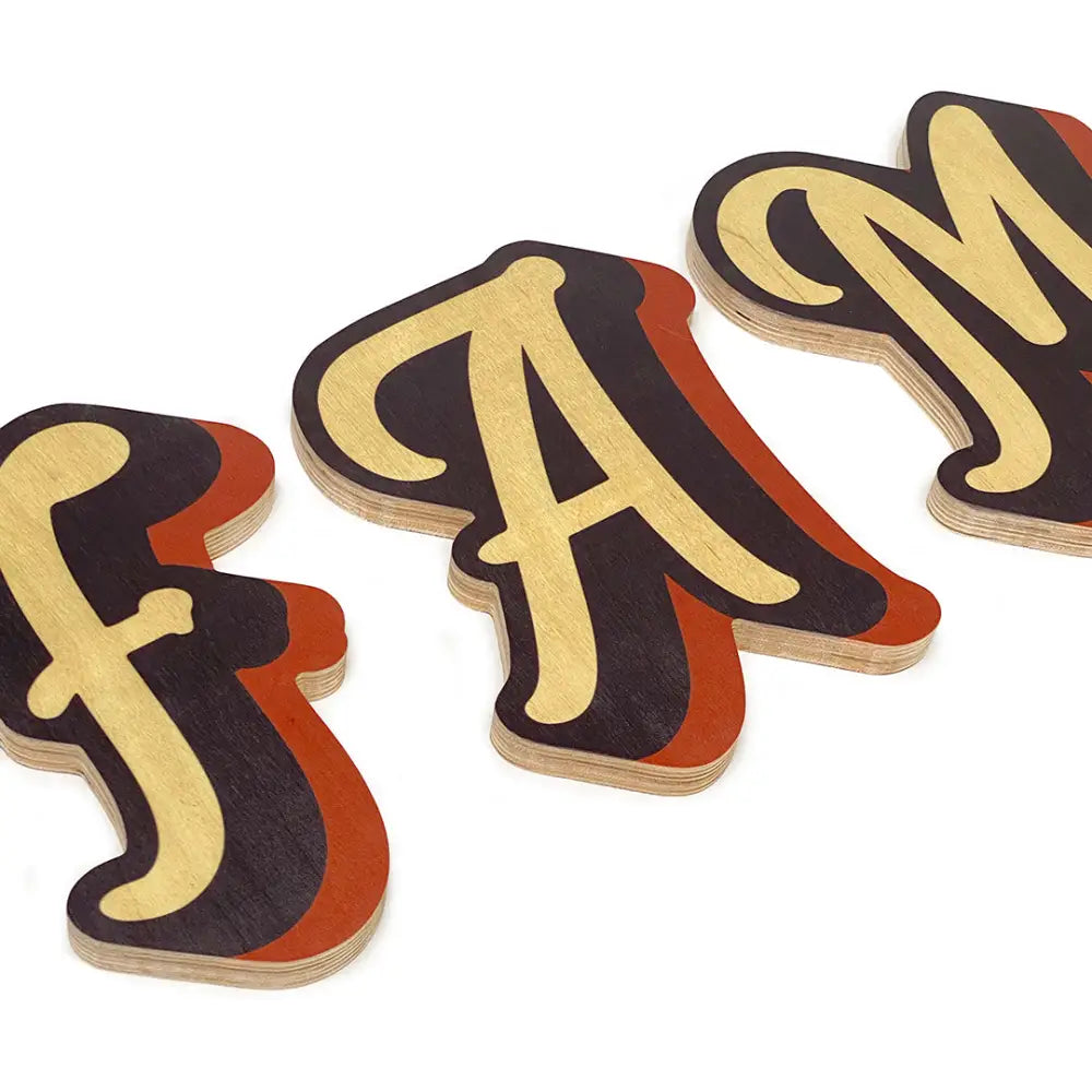 Three-dimensional letters spelling out ’fam’ in a stylized, retro-inspired font.