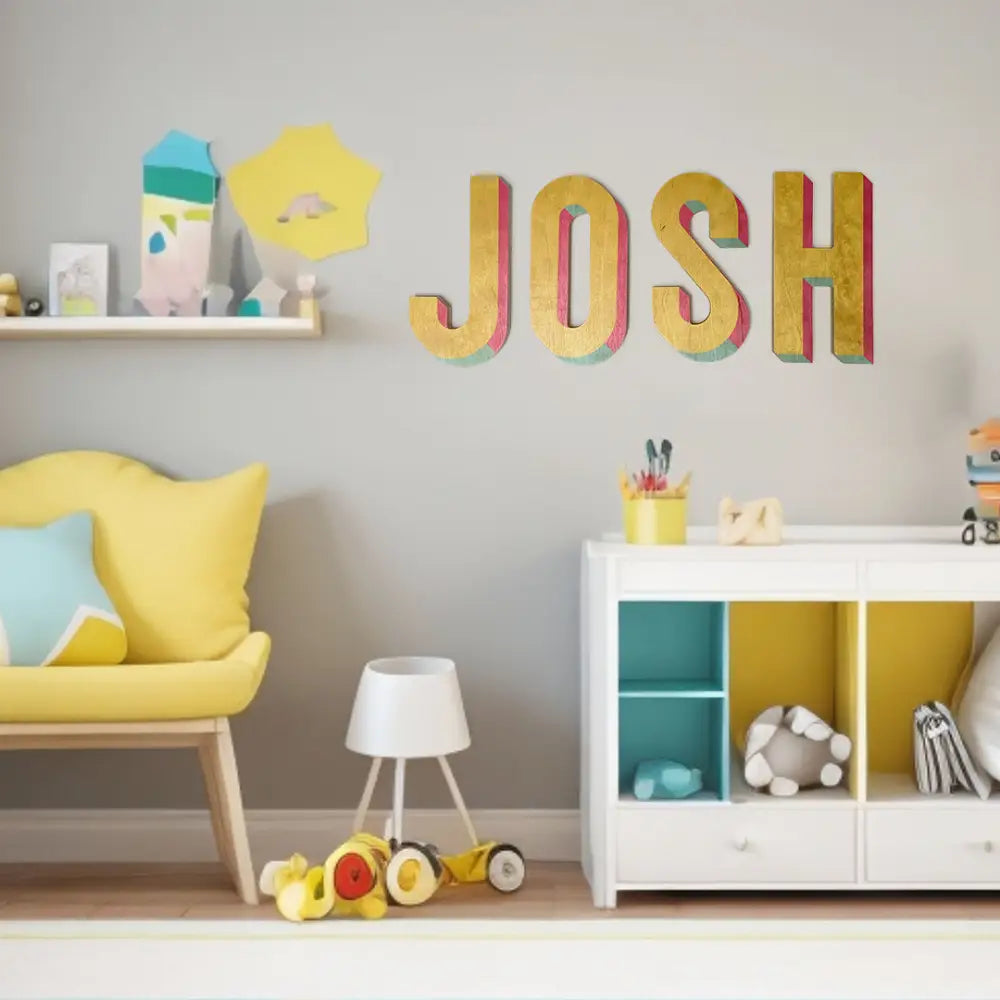 Colorful wooden letters spelling out ’JOSH’ on a wall.