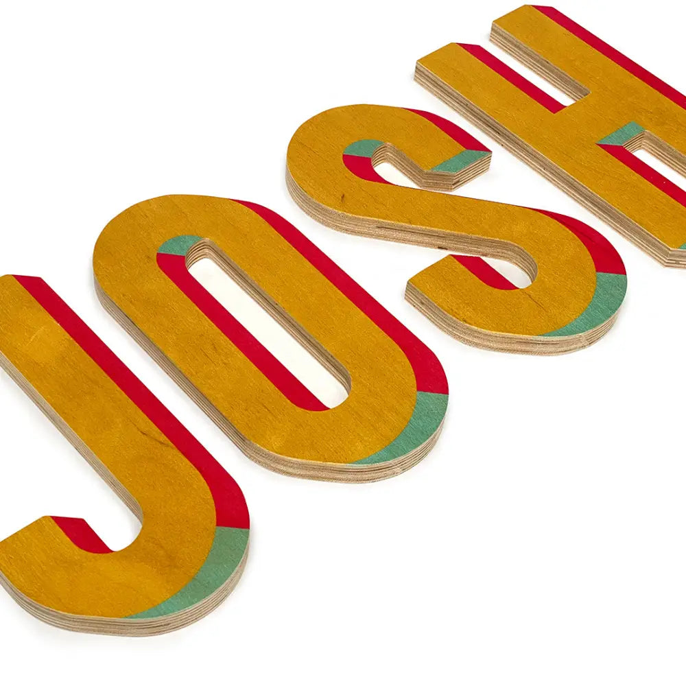 Three-dimensional letters spelling out ’JOSH’ in yellow with red and teal accents.