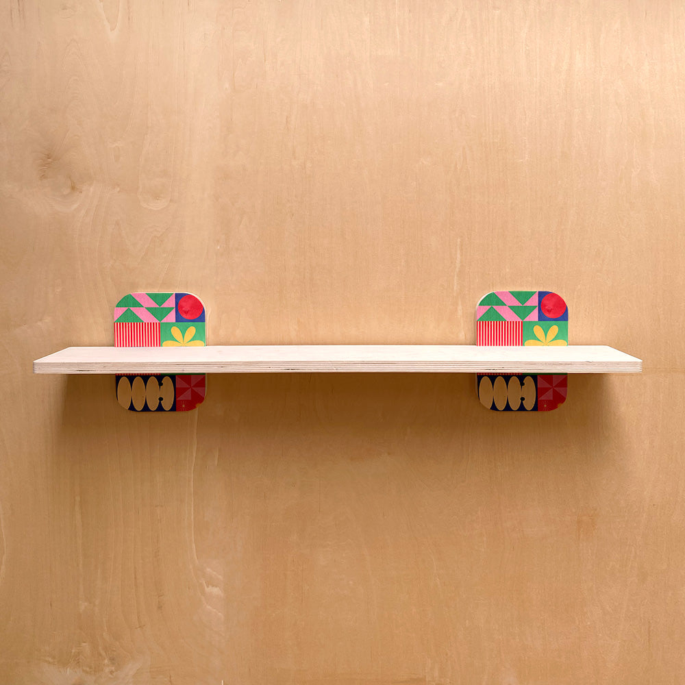 White wall shelf with colorful patterned supports for sturdy wall shelves display