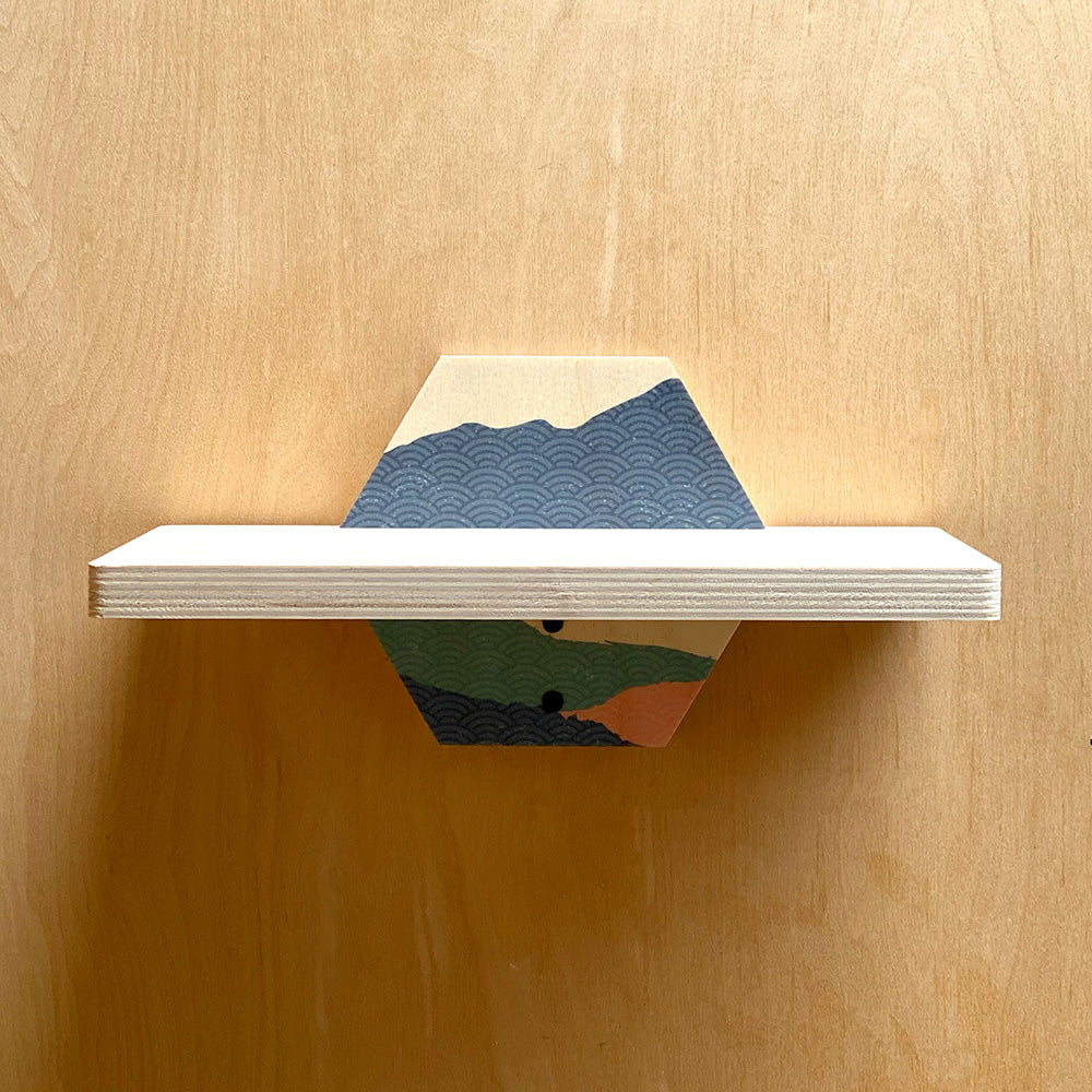 Hexagonal sturdy wall shelf with mountain design for stylish storage and decor