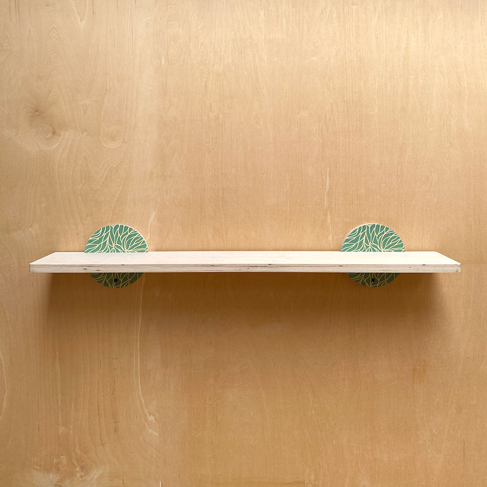White sturdy wall shelf with patterned supports from Nature Inspired Sturdy Wall Shelf collection