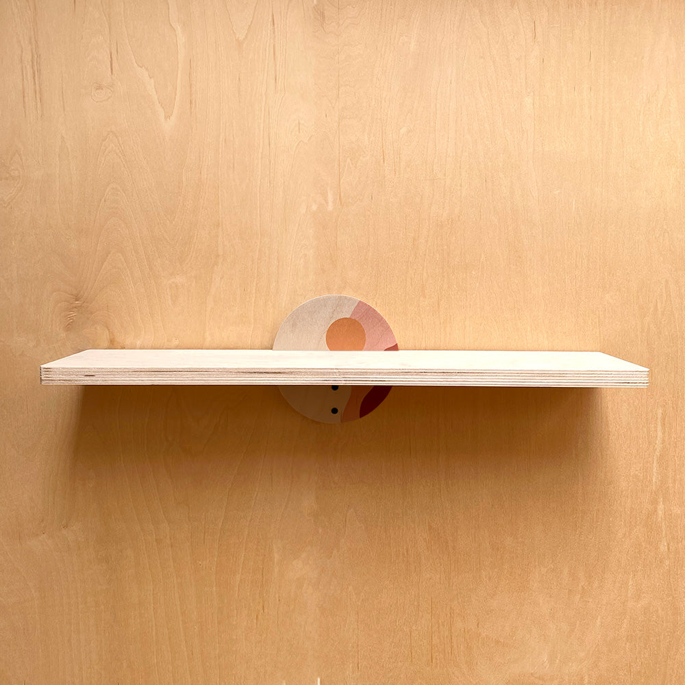 Wooden wall shelf with circular support, ideal for artistic and sturdy wall decor