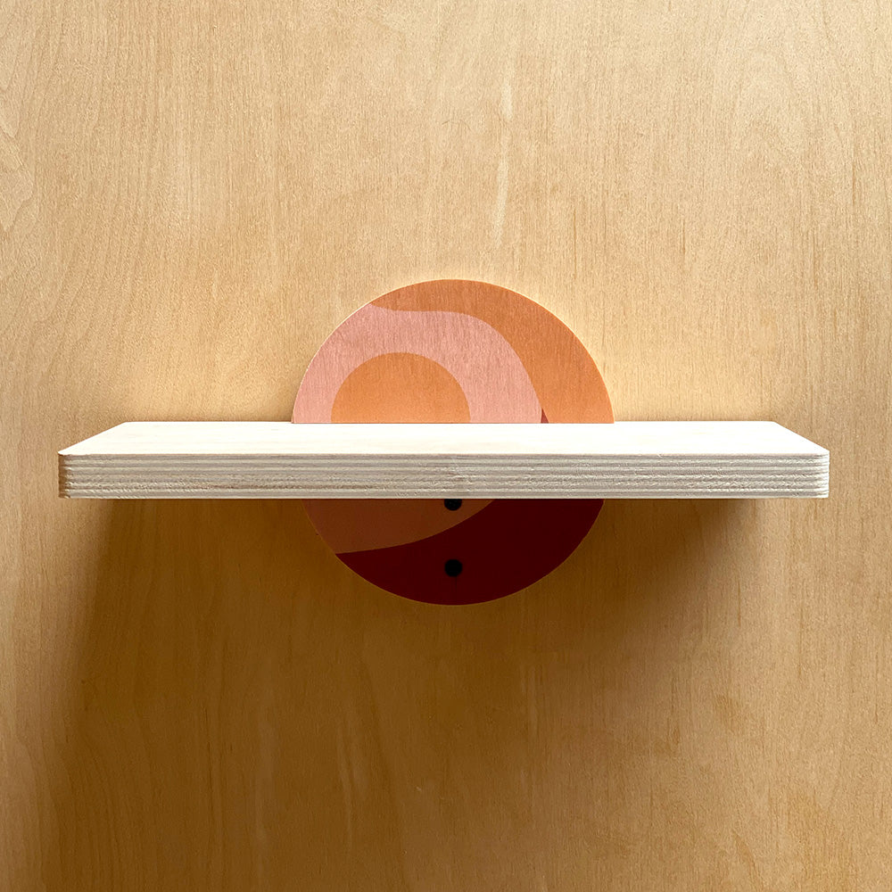 Wooden wall shelf with painted semicircle supports for stylish home decor