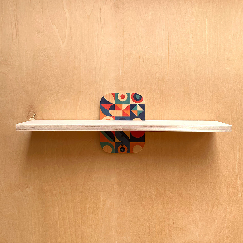 White shelf with geometric support showcasing the exclusive geometric sturdy wall shelf