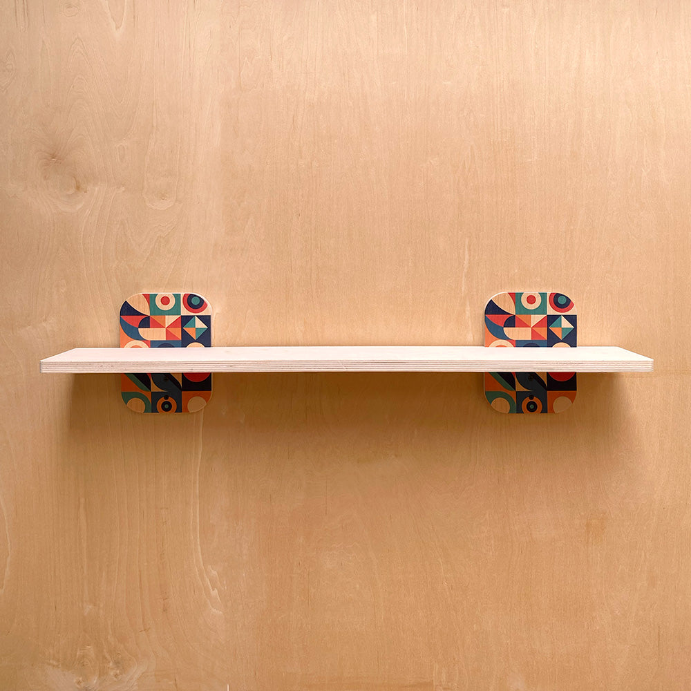 White shelf with patterned supports perfect for a sturdy wall shelf with exclusive geometric design